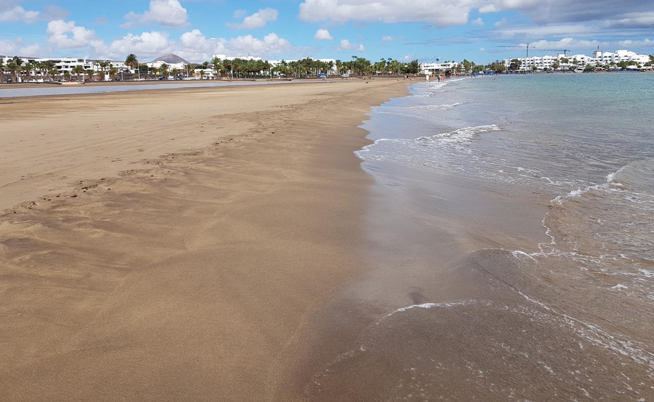 Playa Pocillos'in fotoğrafı kahverengi kum yüzey ile