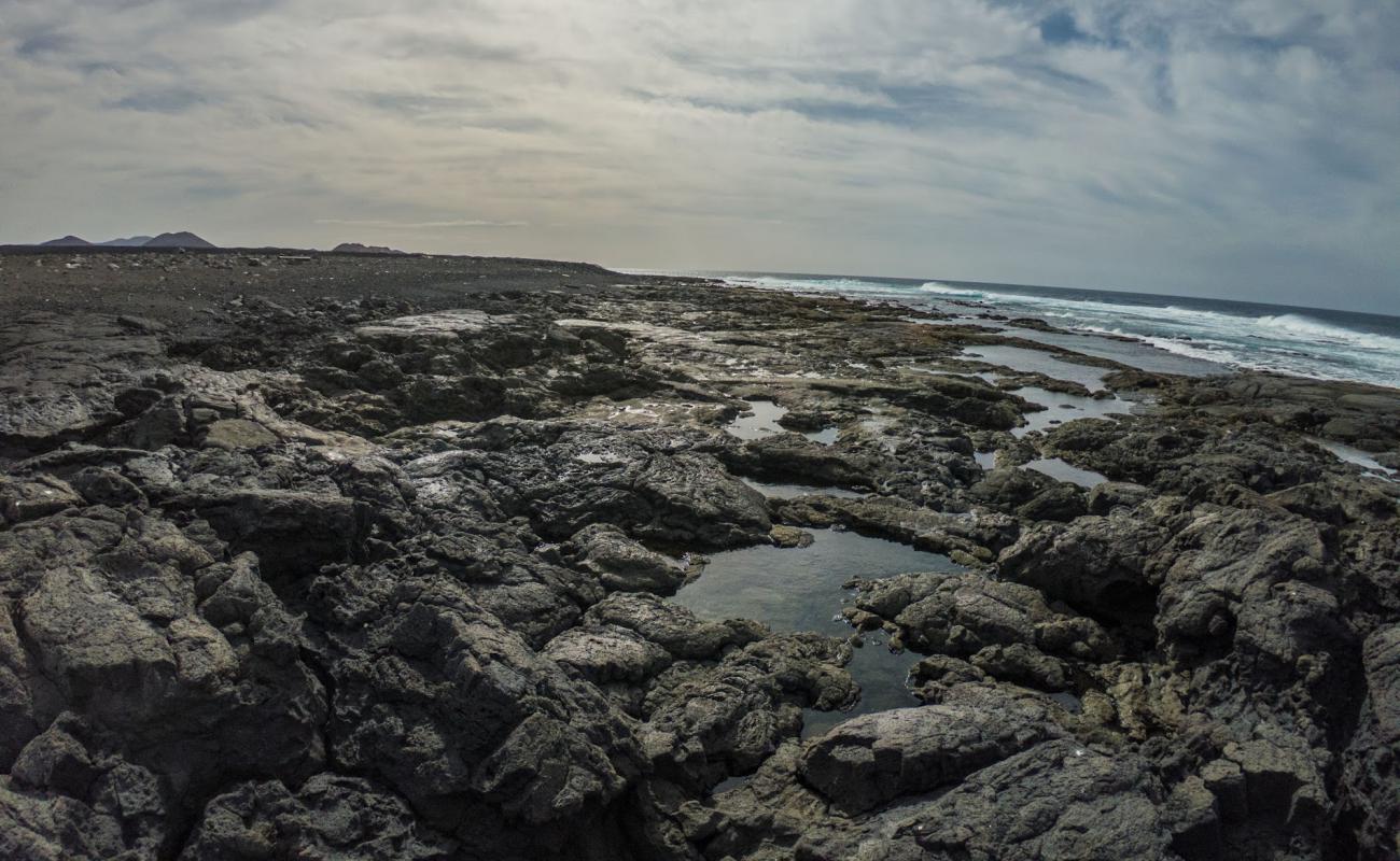 Playa del Cochino'in fotoğrafı taşlı kum yüzey ile