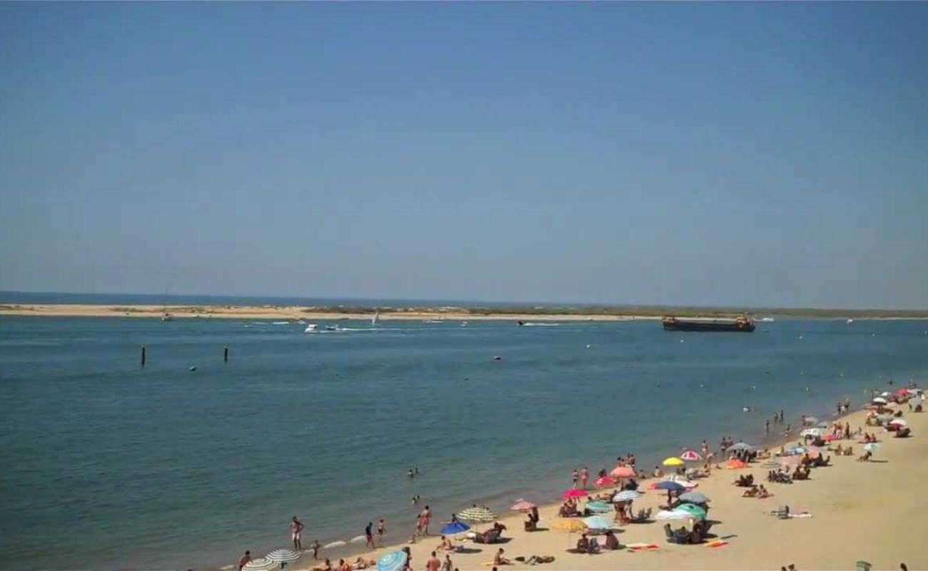 Playa El Rompido'in fotoğrafı parlak kum yüzey ile