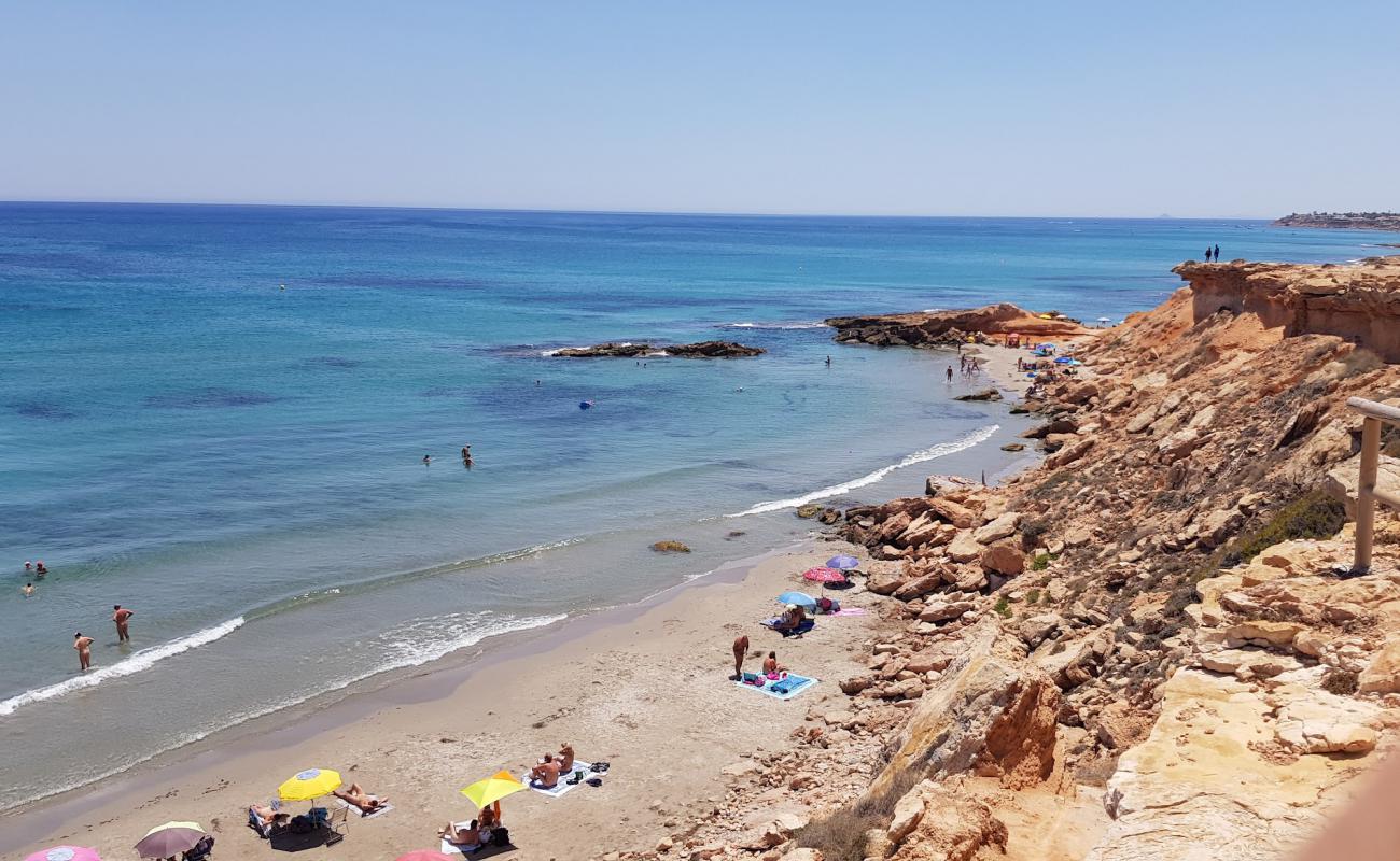 Cala La Mosca'in fotoğrafı parlak kum yüzey ile