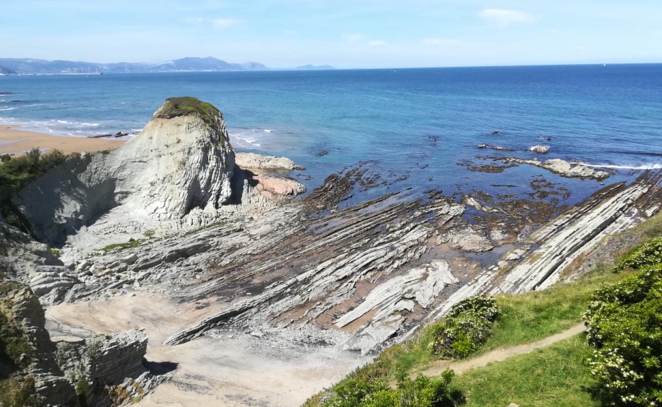 Playa Ugeraga'in fotoğrafı gri kum yüzey ile