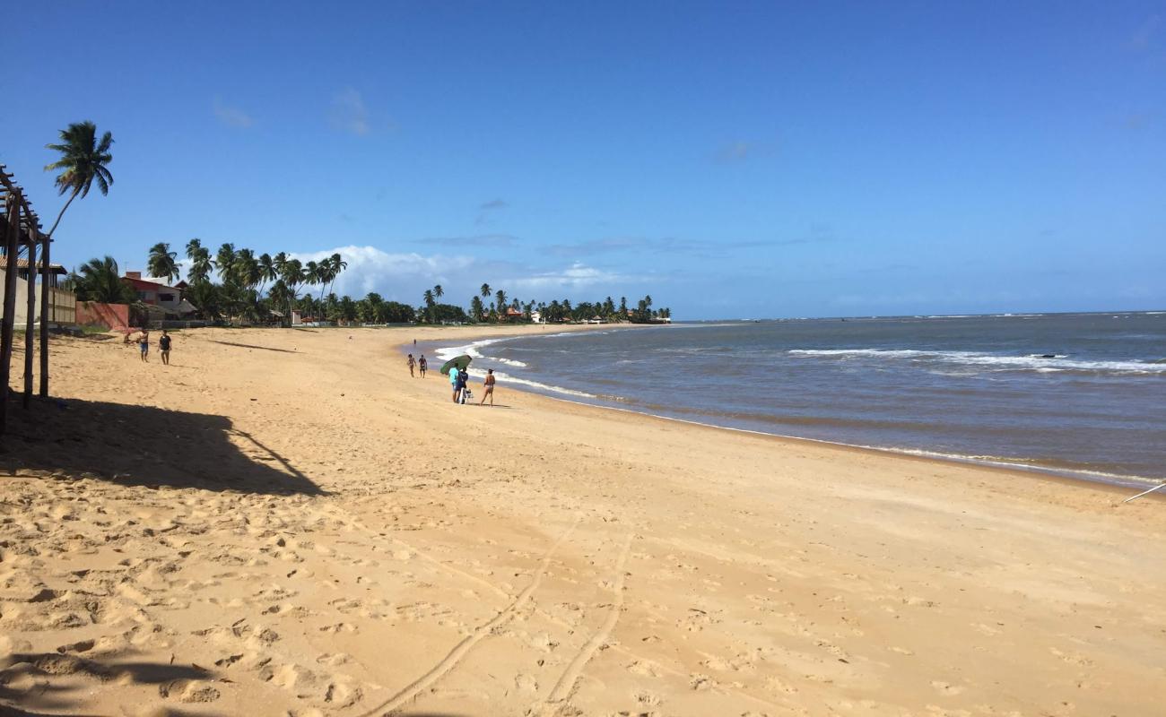 Praia de Tabuba'in fotoğrafı parlak kum yüzey ile