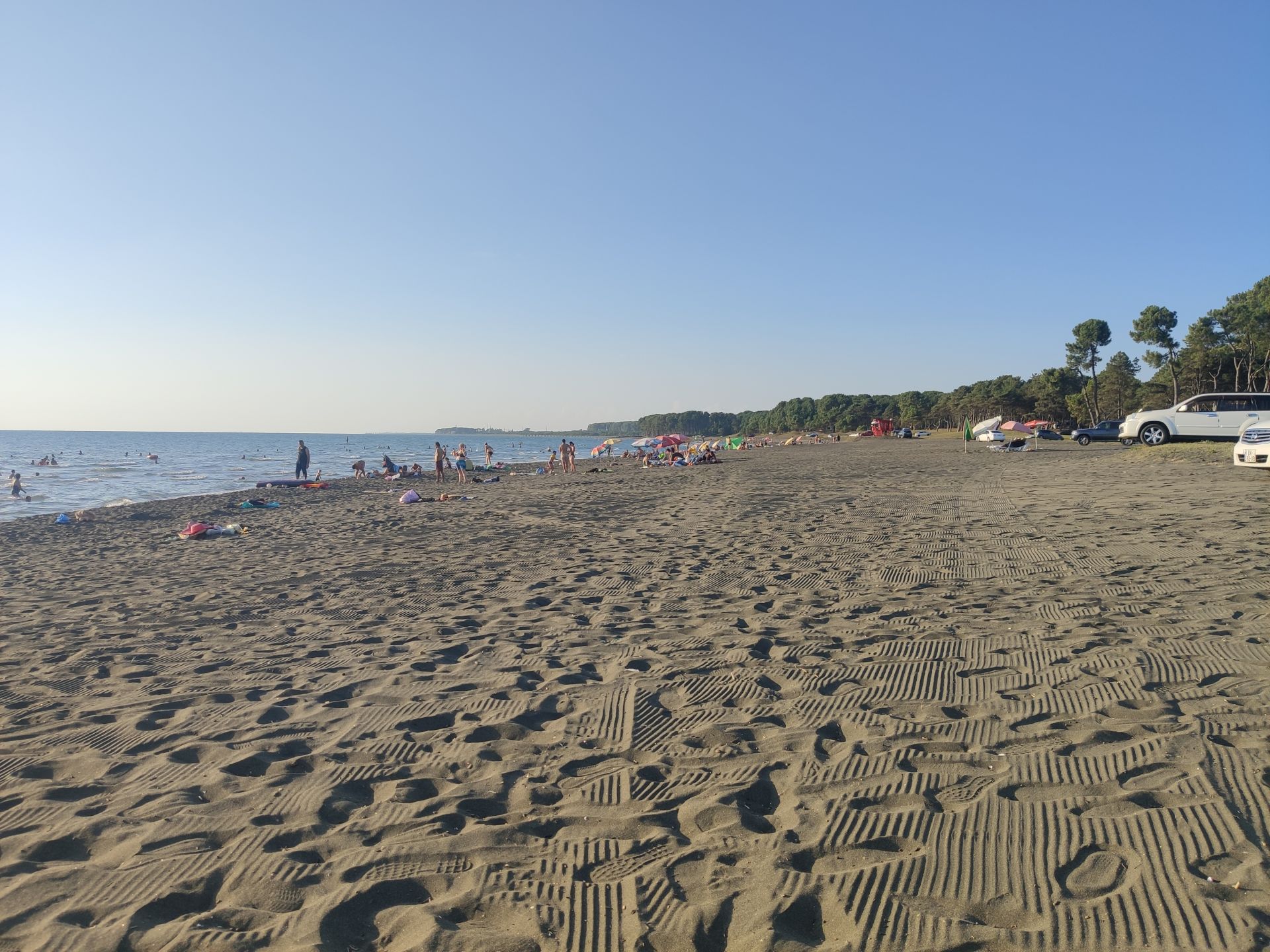 Ureki Nature beach'in fotoğrafı siyah kum yüzey ile