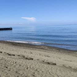 Ureki Nature beach'in fotoğrafı turkuaz saf su yüzey ile